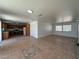 Well-lit kitchen featuring ample wooden cabinetry and an open floor plan perfect for cooking and entertaining at 6905 Singing Dunes Ln, Las Vegas, NV 89145