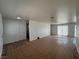 Open-concept living area featuring tile flooring and access to other rooms at 6905 Singing Dunes Ln, Las Vegas, NV 89145
