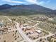 A tranquil town setting is displayed here, highlighting red homes, set against a scenic mountain backdrop at 70 Camp Bonanza Rd, Las Vegas, NV 89124