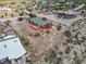A red home showcases a backyard deck, set against the backdrop of a desert landscape at 70 Camp Bonanza Rd, Las Vegas, NV 89124