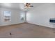 Bedroom with neutral colored walls, carpet flooring, and large windows at 70 Camp Bonanza Rd, Las Vegas, NV 89124