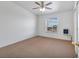 Bedroom with neutral carpet, window, ceiling fan and wall heater at 70 Camp Bonanza Rd, Las Vegas, NV 89124