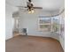 Bedroom with neutral colored walls, carpet flooring, and large windows at 70 Camp Bonanza Rd, Las Vegas, NV 89124