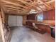 Unfinished garage with exposed beams and storage cabinets along the wall at 70 Camp Bonanza Rd, Las Vegas, NV 89124