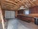 Unfinished garage with exposed beams and storage cabinets along the wall at 70 Camp Bonanza Rd, Las Vegas, NV 89124