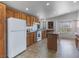 Bright kitchen with ample cabinets, island, and view windows at 70 Camp Bonanza Rd, Las Vegas, NV 89124