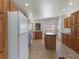 Bright kitchen with ample cabinets, island, and views of the surrounding landscape at 70 Camp Bonanza Rd, Las Vegas, NV 89124