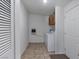 Laundry room with washer, dryer and built-in cabinets at 70 Camp Bonanza Rd, Las Vegas, NV 89124