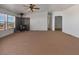 Bright living room featuring large windows and a wood burning fireplace at 70 Camp Bonanza Rd, Las Vegas, NV 89124