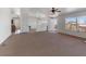 Bright living room with view windows, arched doorway, and front door access at 70 Camp Bonanza Rd, Las Vegas, NV 89124