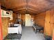 Inside shed featuring generator, storage shelves and wooden walls, perfect for workshop or extra storage at 70 Camp Bonanza Rd, Las Vegas, NV 89124
