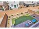 Landscaped backyard with green space, patio area, and stylish outdoor seating for relaxation at 7107 Tilligerry St, North Las Vegas, NV 89084