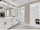 Modern bathroom with double vanity, framed glass shower, and access to a walk-in closet at 7107 Tilligerry St, North Las Vegas, NV 89084