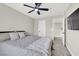 Comfortable bedroom with soft carpet, flat screen TV, and view of the upstairs hallway at 7107 Tilligerry St, North Las Vegas, NV 89084