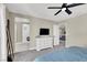 Spacious bedroom with plush carpet, a ceiling fan, and an ensuite bathroom with a glass shower at 7107 Tilligerry St, North Las Vegas, NV 89084