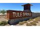 Entrance to the Tule Springs community showcasing modern signage and landscaped surroundings at 7107 Tilligerry St, North Las Vegas, NV 89084