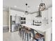 Modern kitchen with white cabinets, stainless steel appliances, and quartz countertops at 7107 Tilligerry St, North Las Vegas, NV 89084