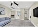 Open-concept upstairs living area with plush carpet, access to a laundry room, and lots of natural light at 7107 Tilligerry St, North Las Vegas, NV 89084