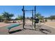Outdoor community workout area with various exercise equipment under a clear blue sky at 7107 Tilligerry St, North Las Vegas, NV 89084