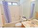 Cozy bathroom with shower-tub combo, single sink vanity, and a large mirror at 731 W Calvada Blvd, Pahrump, NV 89048