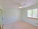Comfortable bedroom with carpet flooring, ceiling fan and a window, ideal for rest at 731 W Calvada Blvd, Pahrump, NV 89048