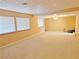 Large bonus room with neutral walls, carpet, and multiple windows offering ample natural light at 731 W Calvada Blvd, Pahrump, NV 89048