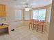 Breakfast nook featuring tiled floor, large windows, and three chairs for casual dining at 731 W Calvada Blvd, Pahrump, NV 89048