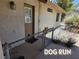 Exterior view of a side yard with a secure dog run or pet area at 731 W Calvada Blvd, Pahrump, NV 89048