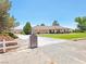 A lovely home with a brick pillar entrance and a large green lawn at 731 W Calvada Blvd, Pahrump, NV 89048