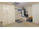 Garage area with built in cabinets and door leading outside at 731 W Calvada Blvd, Pahrump, NV 89048