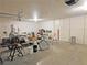 Spacious garage with ample storage, featuring wall-mounted cabinets and room for hobbies at 731 W Calvada Blvd, Pahrump, NV 89048