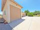 Exterior shot of garage featuring multiple bays and a paved driveway at 731 W Calvada Blvd, Pahrump, NV 89048