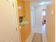 Hallway features tile flooring, overhead cabinets, and leads to other areas of the home at 731 W Calvada Blvd, Pahrump, NV 89048