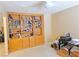 Living room featuring built-in wooden bookshelves, carpeted flooring, and neutral wall paint at 731 W Calvada Blvd, Pahrump, NV 89048