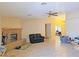 Inviting living room with a brick fireplace and tile floors, perfect for relaxation at 731 W Calvada Blvd, Pahrump, NV 89048