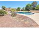 A beautiful pool in a backyard setting featuring mature landscaping and a spacious deck at 731 W Calvada Blvd, Pahrump, NV 89048