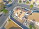 Aerial view of the property featuring a well-maintained backyard with a patio and desert landscaping at 765 Butternut Ct, Henderson, NV 89014