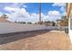 Spacious backyard featuring a concrete patio, gravel accents, and a sturdy block wall for privacy at 765 Butternut Ct, Henderson, NV 89014