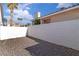 Fenced backyard featuring easy-care desert landscaping and privacy at 765 Butternut Ct, Henderson, NV 89014