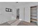 Spare bedroom with tan carpet, closet with storage, and neutral walls at 765 Butternut Ct, Henderson, NV 89014