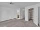 Clean bedroom with carpeted floors and an open closet at 765 Butternut Ct, Henderson, NV 89014
