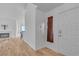 Foyer featuring wood floors, a front door, and a view into the living room at 765 Butternut Ct, Henderson, NV 89014