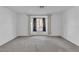 Bright living room featuring large windows, carpet floors and neutral wall paint at 765 Butternut Ct, Henderson, NV 89014