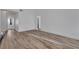 Spacious living room with light-colored hardwood floors and neutral wall paint at 765 Butternut Ct, Henderson, NV 89014
