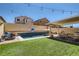 Lush backyard featuring a sparkling pool, covered patio, and ample space for outdoor activities at 7761 Sagamore Bay Ct, Las Vegas, NV 89179