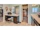 Bathroom with double sinks, vanity area, and a large walk-in closet at 7761 Sagamore Bay Ct, Las Vegas, NV 89179