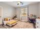 Cozy bedroom with natural light, playful decor, and comfortable furnishings at 7761 Sagamore Bay Ct, Las Vegas, NV 89179