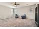 Bonus room features neutral tones, plush carpet, ceiling fan and lots of natural light at 7761 Sagamore Bay Ct, Las Vegas, NV 89179
