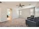 Bonus room with a view into ensuite bathroom, windows and ceiling fan at 7761 Sagamore Bay Ct, Las Vegas, NV 89179