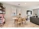 Cozy dining area with a charming table set and a view of the backyard at 7761 Sagamore Bay Ct, Las Vegas, NV 89179